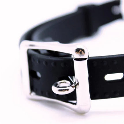 Close-up of Mouthgag with Ball Silicone featuring metal buckle and adjustable strap with multiple holes for a secure fit.