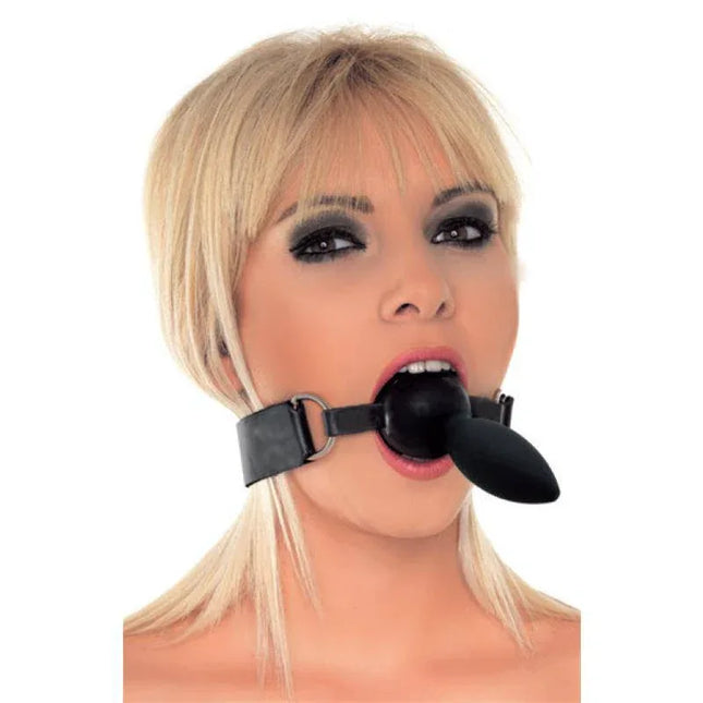 Person wearing Mouthgag with Plug Silicone, featuring an adjustable strap and metal buckle for secure, comfortable restraint.