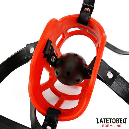 Muzzle with Breathable Gag Ball featuring a red exterior and black jaw from the Latetobed BDSM line for intense play.