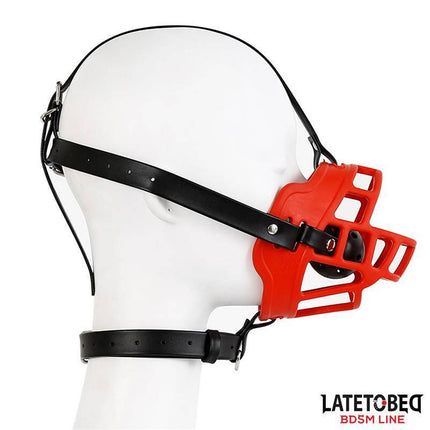 Muzzle with Breathable Gag Ball in striking red design from Latetobed BDSM line, featuring black straps for secure, intense play.