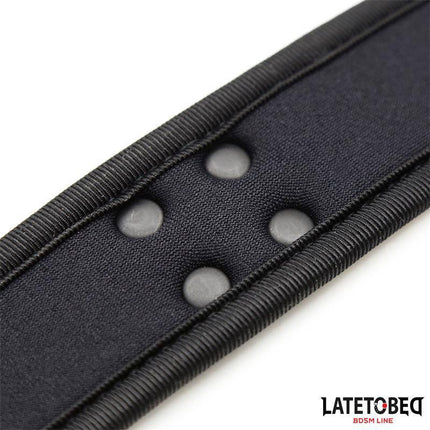 Close-up of Neoprene Collar Adjustable, black with buttons, designed for comfort and flexible fit, enhancing durability and style.
