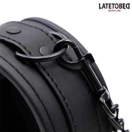Close-up of LATETOBED Neoprene Handcuffs Black showcasing secure clasp and black neoprene material for comfortable restraint.