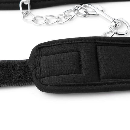 Close-up of Neoprene Velcro handcuffs with soft padding and chain.