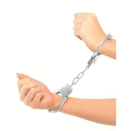 Hands in Metal Handcuffs made of nickel-plated steel for costumes or role-play, showcasing durability and polished finish.