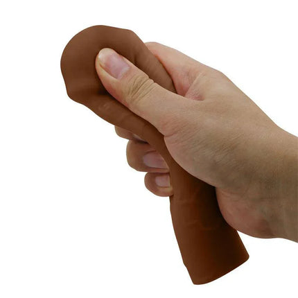 Nile Penis Extended Sleeve held in hand, showing flexible, realistic texture for enhanced sensation and performance.