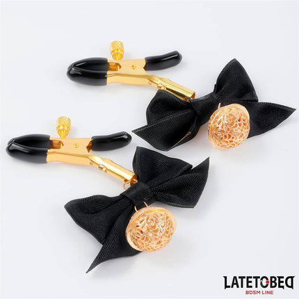 Nipple clamps with Bow Black featuring gold bells and adjustable clamps from Latetobed BDSM Line.