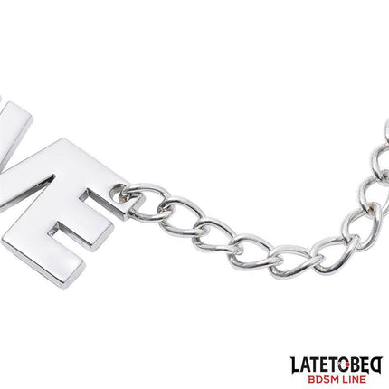Close-up of Latetobed BDSM Line's Nipple clamps with Chain - Slave featuring a sturdy chain and bold metal design.