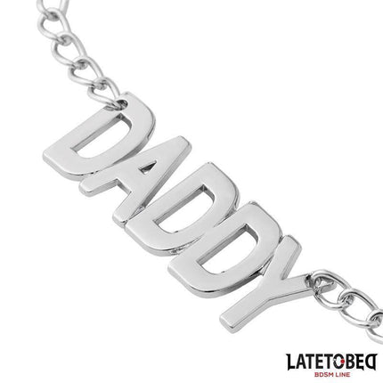 Close-up of Nipple Clamps with Daddy Word Pendant showcasing "DADDY" charm with sleek metal design for intimate playful moments.