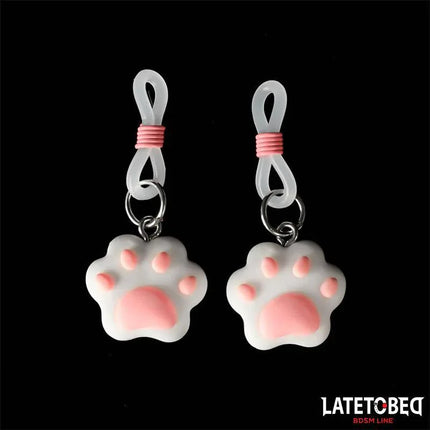 Nipple clamps with Kitty Paw featuring metal core and silicone cushion, designed for BDSM lovers, with playful kitty paw charms.