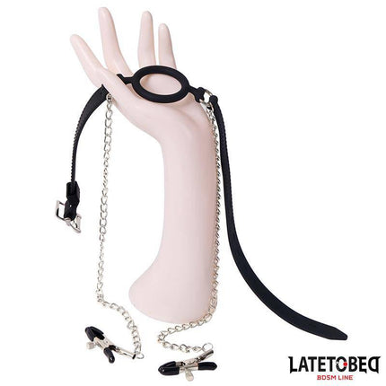 Open Mouth Gag with Nipple Clamps on mannequin hand from Latetobed BDSM collection