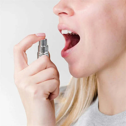 Person using Oral Sex Spray Fresh Breath Mint 11g for fresh breath