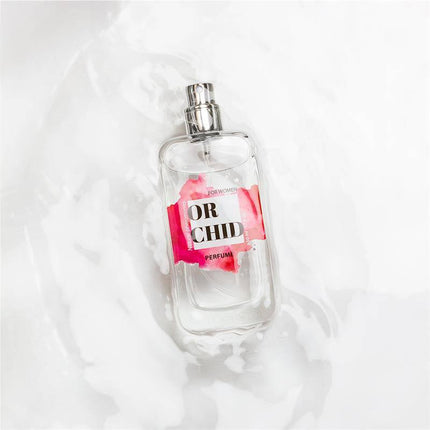 Bottle of Orchid Natural Perfume with Pheromones Spray 50 ml on white background, showcasing sensual feminine fragrance design.