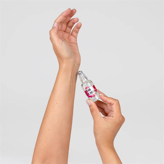 Person applying Orchid Oil Pheromones Perfume 20 ml to wrist for a confident scent