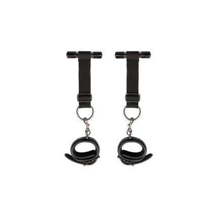 Over the Door Wrist Cuffs in black faux leather with foam interior, featuring adjustable straps for comfortable and secure restraint.