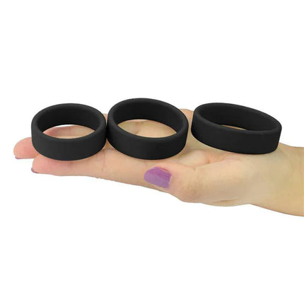 Pack of 3 Penis Ring Power Ring Black silicone rings displayed on hand