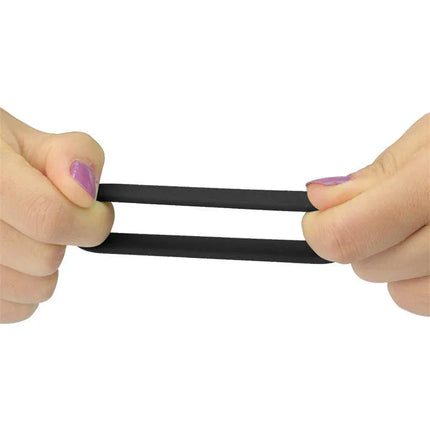 Pack of 3 Penis Ring Power Ring Black being stretched to show flexibility and durability.