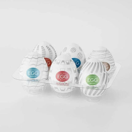 Pack of 6 Tenga Eggs Standard Package with assorted textures displayed in a transparent tray against a light background.