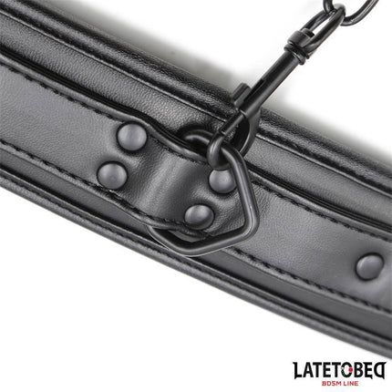 Close-up of black Padded Handcuffs Adjustable with secure rivets and padded design for comfort during use, showcasing elegant restraint gear.