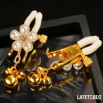 Pearl nipple clamps with adjustable pressure, metal hardware, and pearl accents from Latetobed BDSM line, for secure and elegant restraint.