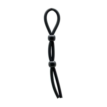 Penis and Ball Strap Black by Rimba, premium silicone cord with adjustable balls for customizable pressure in black.