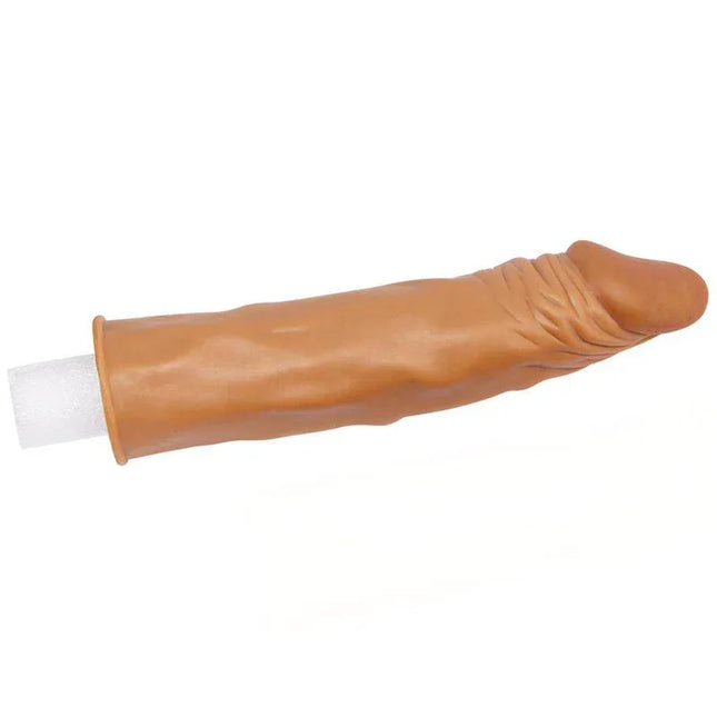 Penis Sleeve Add 2 Pleasure X Tender Brown with realistic design featuring lifelike glans and veined shaft on a white background