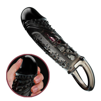 Penis sleeve with vibration Black, textured design, shown in hand for size perspective