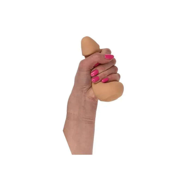Hand squeezing Penis Stress Ball for quick stress relief and humor.
