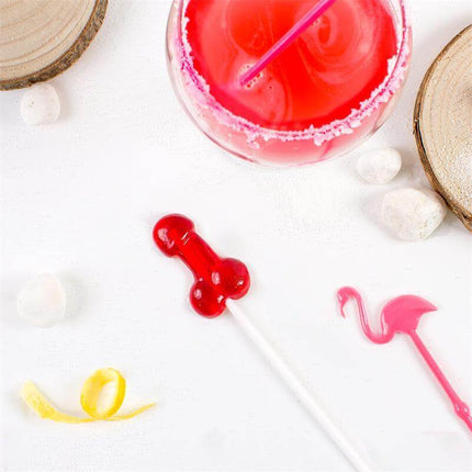 Penis Shaped Lollipop Strawberry Daiquiri Flavor with Alcohol beside a daiquiri cocktail and party decorations