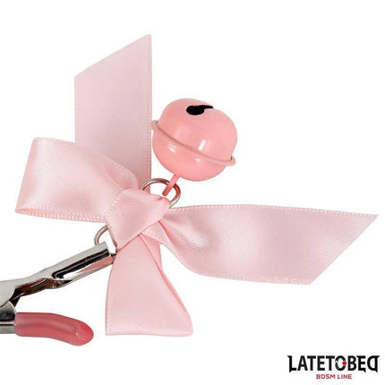 Pink Bow Nipple Clamps with Bell featuring a pastel bow and playful chime, perfect for enhancing sensual experiences.