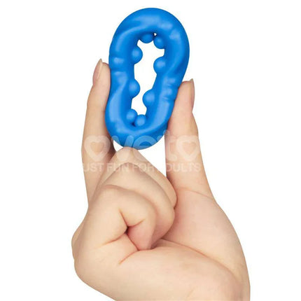 Pinnacle Pro Ridge Bump Stretcher Penis Ring in hand, showcasing its extra-soft silicone material and flexible design for enhanced pleasure.