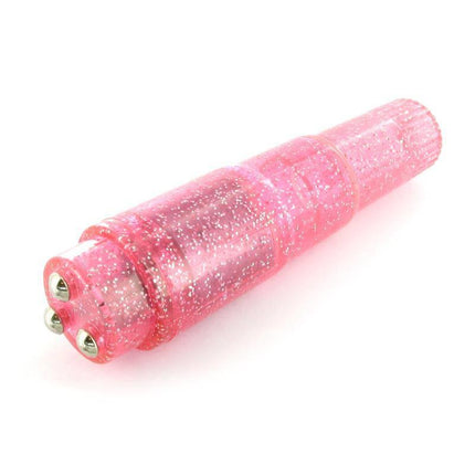 Pocket Rocket Massager Pink with glitter finish and four pleasure caps for customized sensations, compact and waterproof design for travel use.