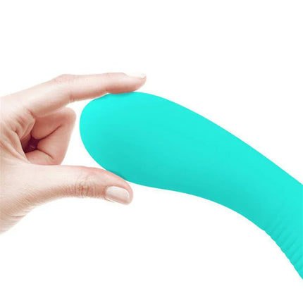 Close-up of Prescott Vibrator USB Silicone Green in hand, showcasing its flexible, soft silicone design and vibrant green color.