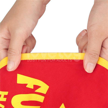Hands holding red and yellow fabric of Printed Vibrating Sexy Panties 28-33, close-up view of stretchy waistband material.