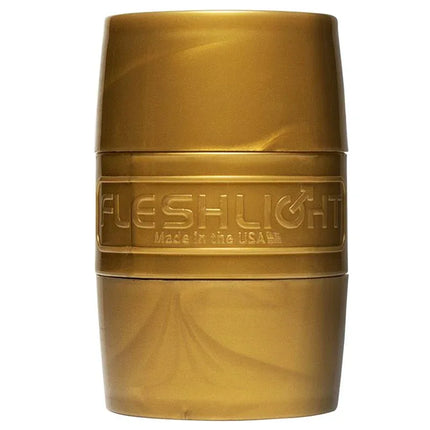 Gold cylindrical case for Quickshot Stamina Training Unit Lady Vagina and Butt, open-ended design for endurance training.