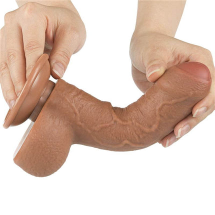 realistic brown dildo sliding skin 7 flexible dildo with suction base held in hands