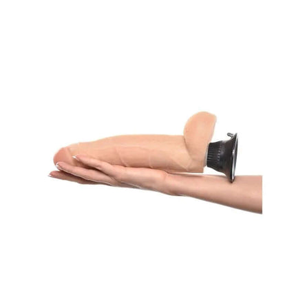 Realistic Vibe No. 7 22,9 cm Flesh with lifelike textures and strong suction-cup base displayed on an outstretched hand.