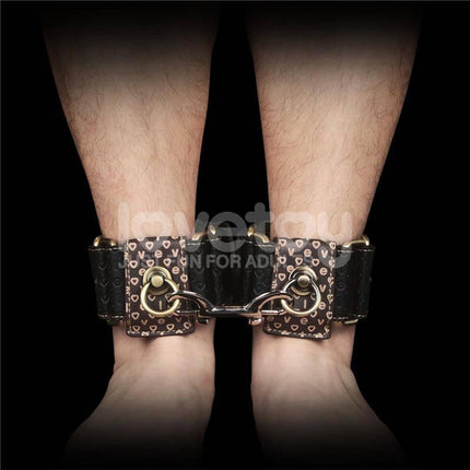 Rebellion Reign Ankle Cuffs with vintage bronze spikes on ankles, showcasing luxury and rustic style for bondage enthusiasts.
