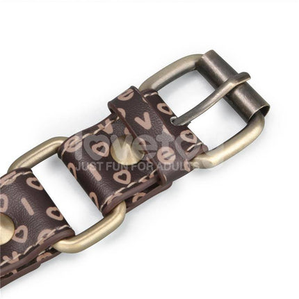 Close-up of buckle on Rebellion Reign Breathable Silicone Ball Gag with antique bronze spikes on faux leather.