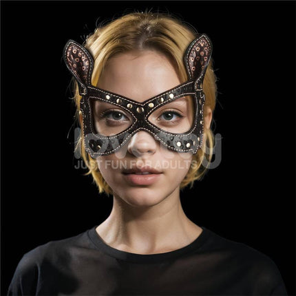 Woman wearing Rebellion Reign Bunny Eye Mask in a dark setting, showcasing durable PU construction and adjustable straps for comfort.