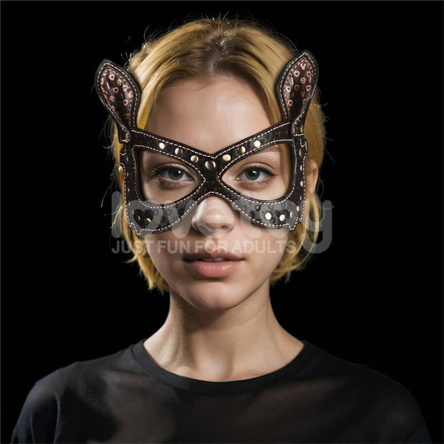 Woman wearing Rebellion Reign Bunny Eye Mask in a dark setting, showcasing durable PU construction and adjustable straps for comfort.