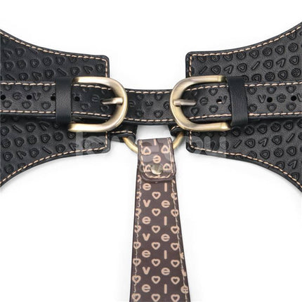 Close-up of Rebellion Reign Full Body Harness in premium PU faux leather with gold-tone buckles and textured pattern.