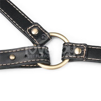 Close-up of black leather straps and metal ring on Rebellion Reign Full Body Harness