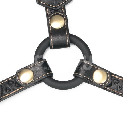 Close-up of Rebellion Reign Full Body Harness in premium PU faux leather with gold hardware details, showcasing punk and sophisticated design.
