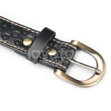 Close-up of Rebellion Reign Full Body Harness buckle in premium faux leather with brass accents.