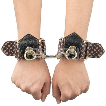 Close-up of Rebellion Reign Handcuffs with durable PU leather-inspired design, showcasing premium craftsmanship and secure restraint.