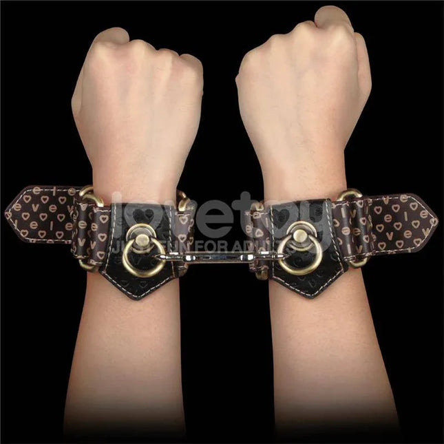 Rebellion Reign Handcuffs showcasing luxurious and durable design with heart patterns for intimate moments.