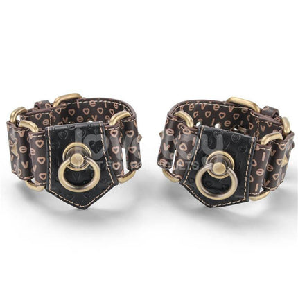 Rebellion Reign Hogtie Set with distinctive handcuffs featuring old-looking bronze spikes for dramatic bondage scenes.