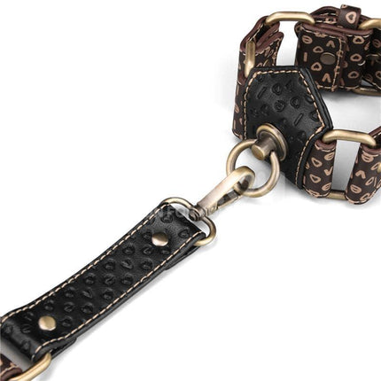 Close-up of Rebellion Reign Hogtie Set with old-looking bronze spikes and leather detailing for premium bondage experience.