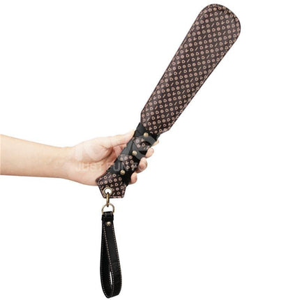 Rebellion Reign Love Paddle 15 with dual-surface design held in hand, showcasing customizable sensation and ergonomic grip.