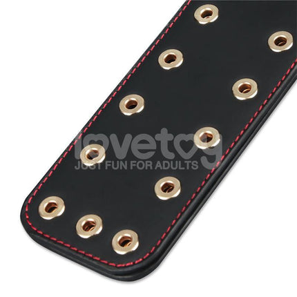 Close-up of black paddle with gold accents from Rebellion Reign Paddle Dual-Branch 15